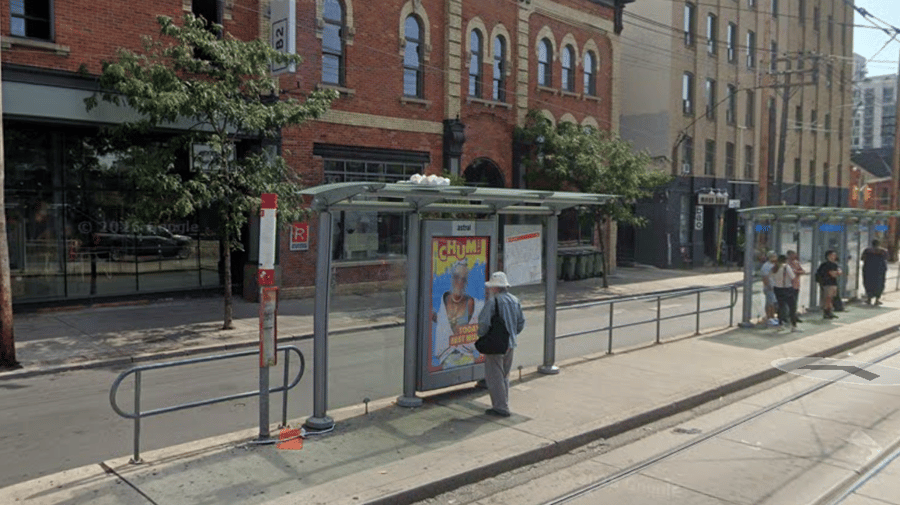 Poles & boards on Queen & Bathurst